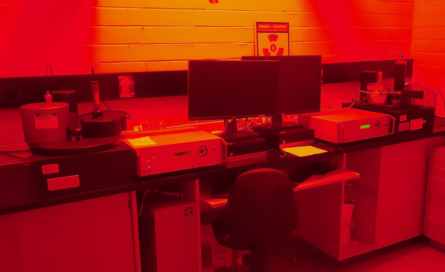 Machine lab lit with only red light.