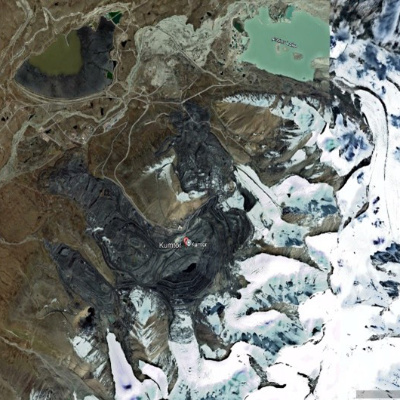 Satellite view of mine with snowy land in east.