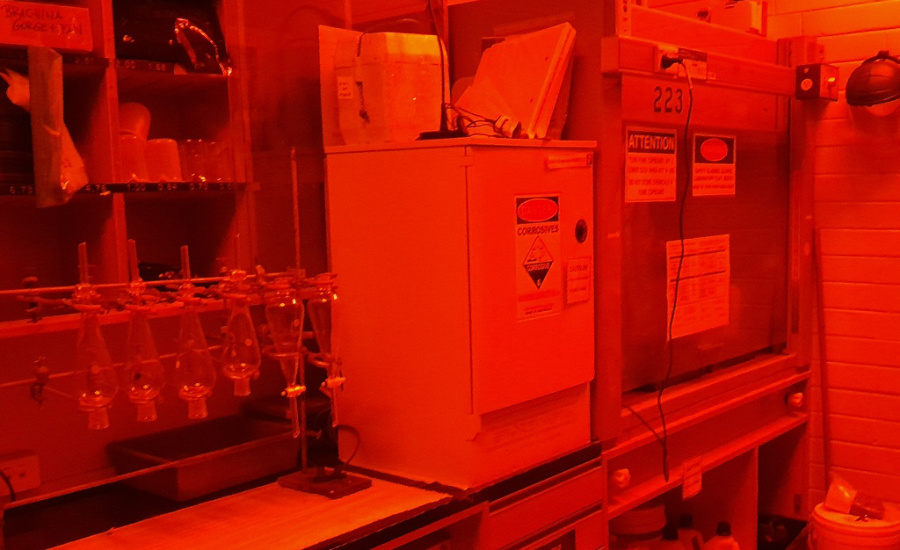 Prep lab lit with only red light.