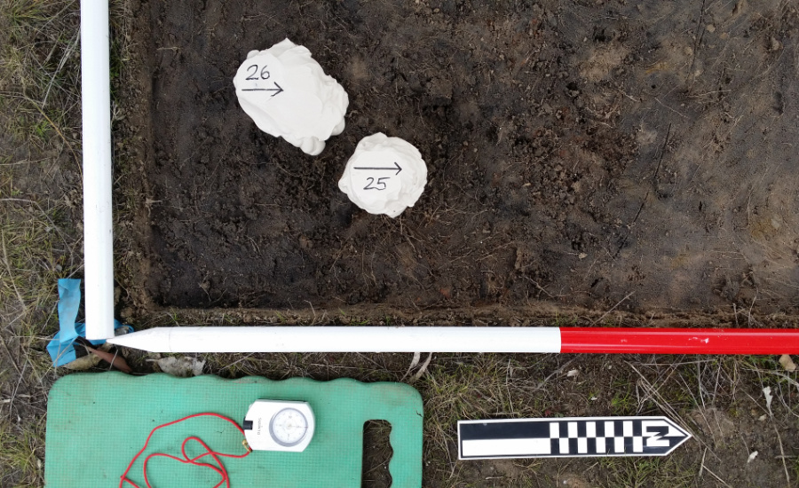 Site measuring tools laid out on the ground