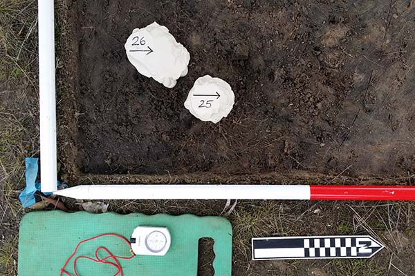 Site measuring tools laid out on the ground