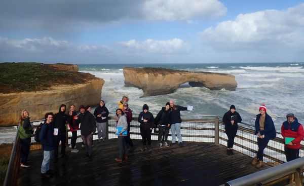 People standing on a viewing deck at the Twelve Apostles.