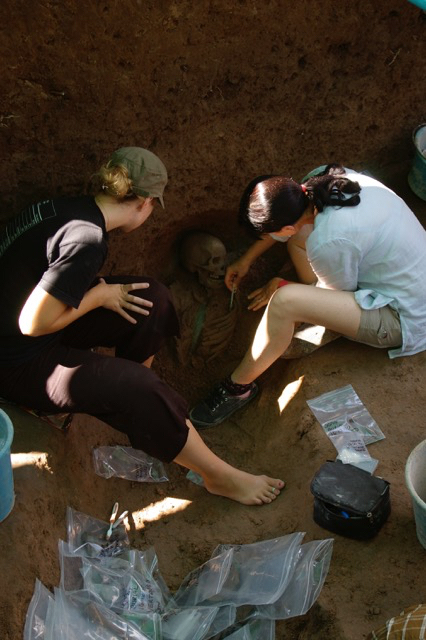 Two students performing an excavation at Phum Sophy, an Iron Age site (500 BCE-500 CE) in NW Cambodia